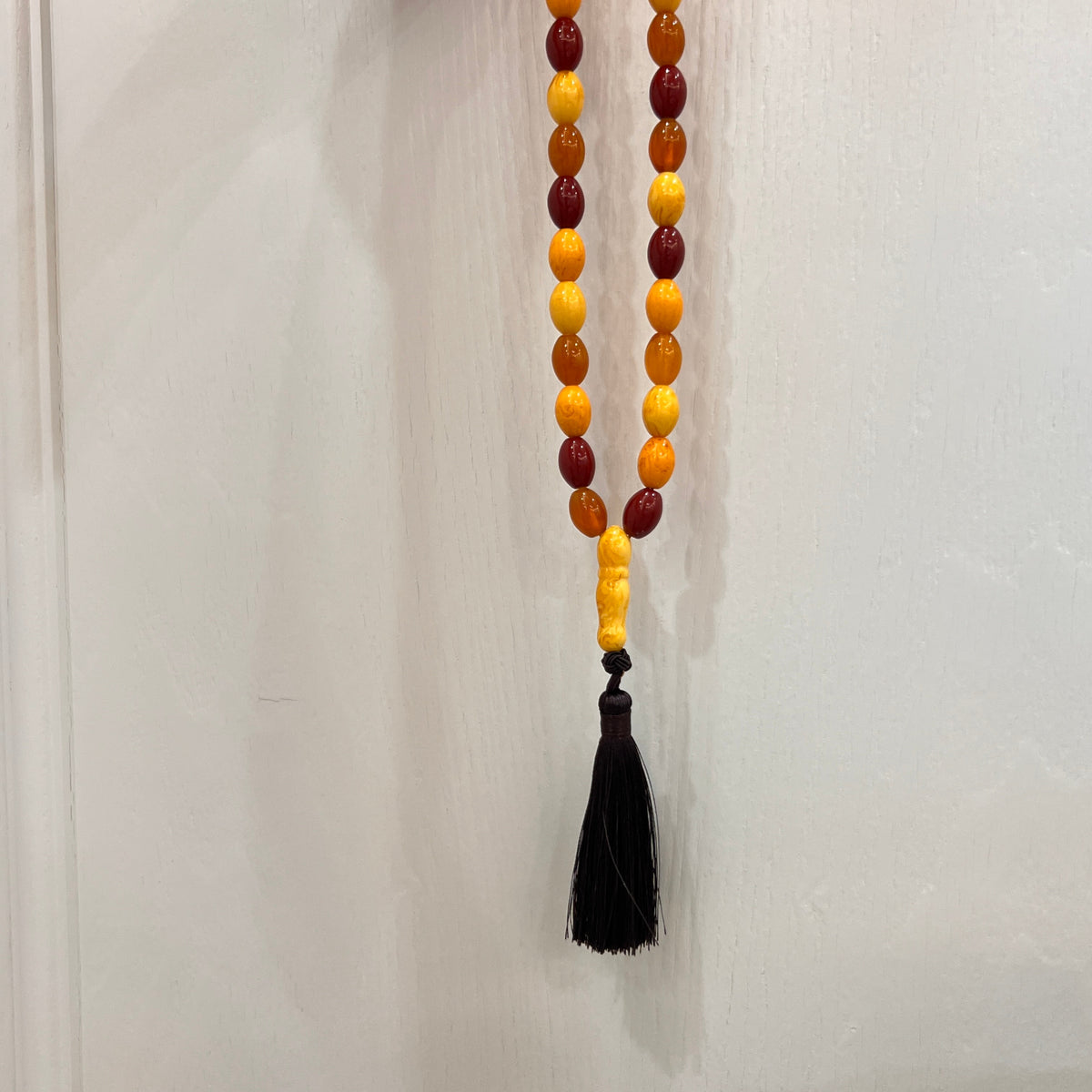Autumn Mosaic 33-bead Tasbih shown hanging with black tassel
