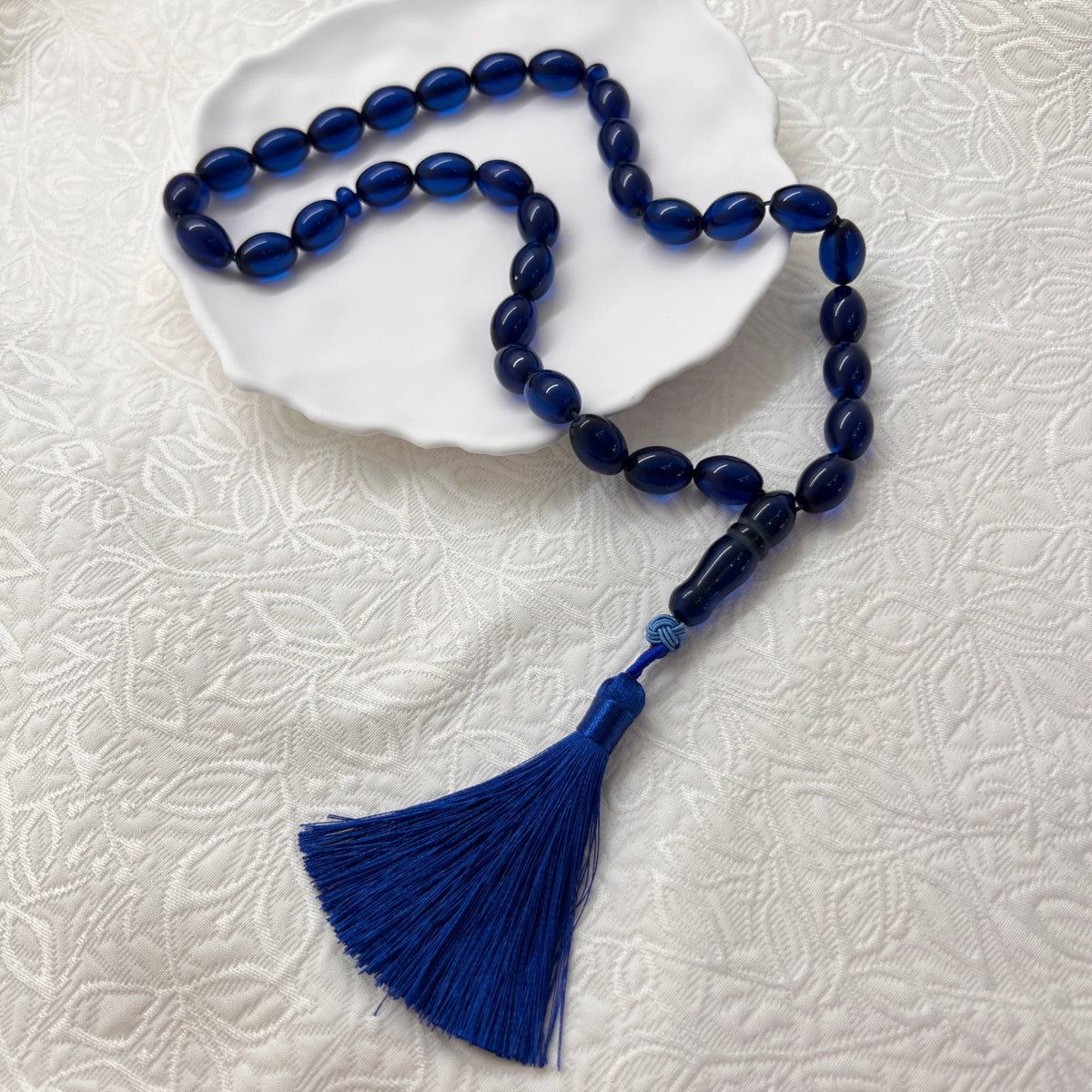 Midnight Blue 33-bead Tasbih displayed on a white dish