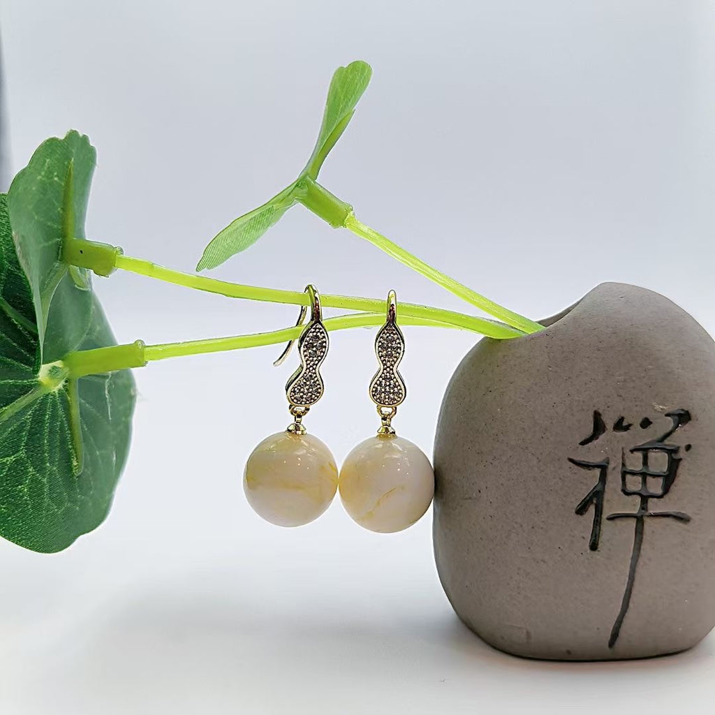 Ivory Twist Resin Drop Earrings — one pair