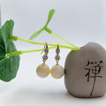 Ivory Twist Resin Drop Earrings — one pair
