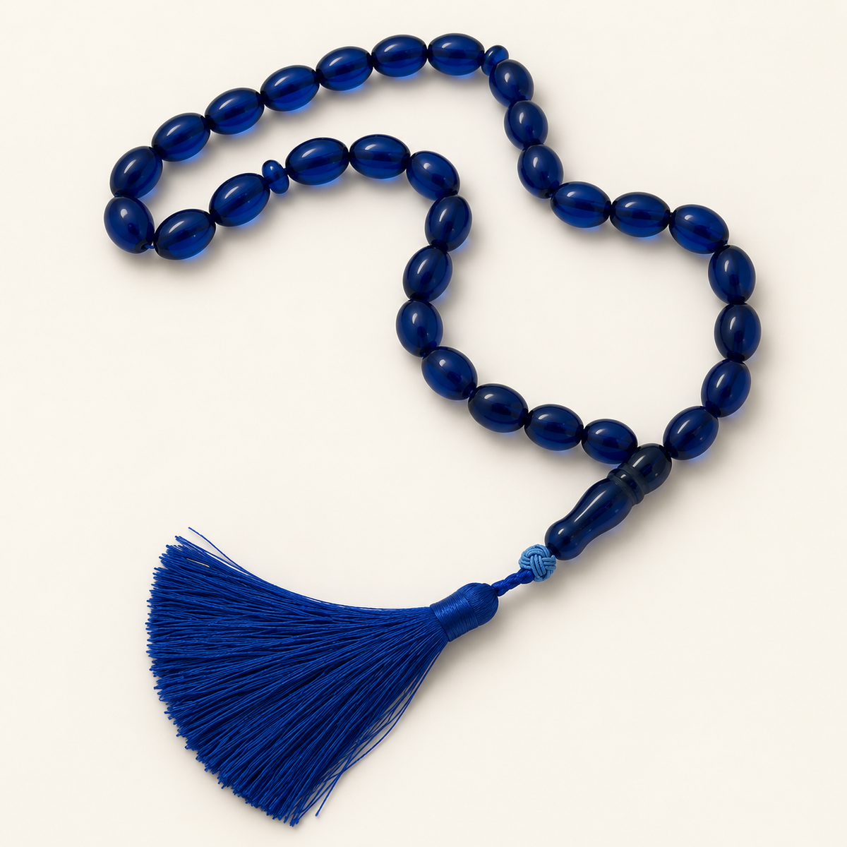 blue 33-bead resin tasbih on cream background