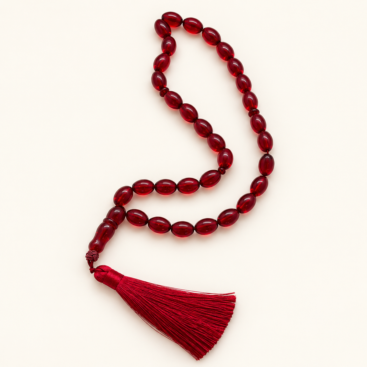 red 33-bead resin tasbih on cream background